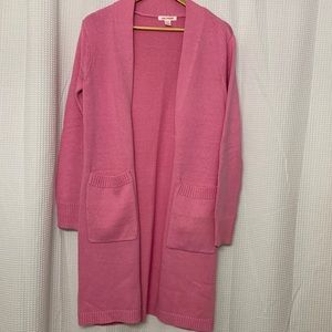 Long pink cardigan.